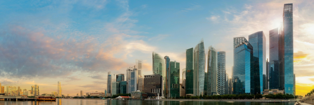 Image of buildings along the bank of a river.